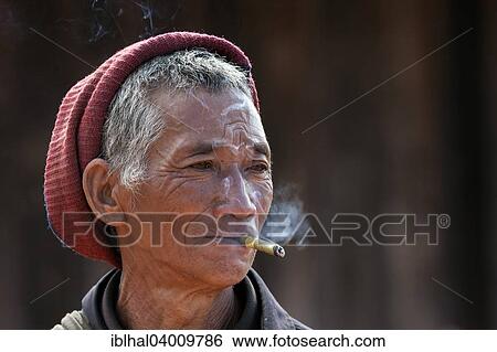 "Man of the Akha ethnic group, with cigar, portrait, near Kyaing Tong, Myanmar, Asia" View Large Photo Image Stock Photograph - "Man of the Akha ethnic group, with cigar, portrait, near Kyaing Tong, Myanmar, Asia". Fotosearch