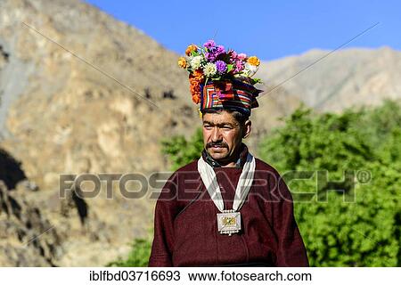"Man of the Brokpa tribe wearing traditional dress with flower headdress, Dah, Ladakh, Jammu and Kashmir, India, Asia" View Large Photo Image Stock Image - "Man of the Brokpa tribe wearing traditional dress with flower headdress, Dah, Ladakh, Jammu and Kashmir, India, Asia". Fotosearch