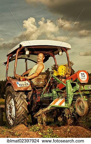 "Man on a tractor, potato harvester" View Large Photo Image Picture - "Man on a tractor, potato harvester". Fotosearch