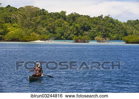 "Man paddling in his canoe, Marovo Lagoon, Western Province, Solomon Islands, Oceania" View Large Photo Image Stock Photograph - "Man paddling in his canoe, Marovo Lagoon, Western Province, Solomon Islands, Oceania". Fotosearch