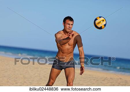 "Man playing beach volleyball, Jandia Playa, Fuerteventura, Canary Islands, Spain, Europe" View Large Photo Image Stock Photograph - "Man playing beach volleyball, Jandia Playa, Fuerteventura, Canary Islands, Spain, Europe". Fotosearch