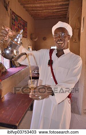 "Man pouring tea into a glass, Merzouga, Meknes-Tafilalet region, Morocco, Africa" View Large Photo Image Stock Image - "Man pouring tea into a glass, Merzouga, Meknes-Tafilalet region, Morocco, Africa". Fotosearch