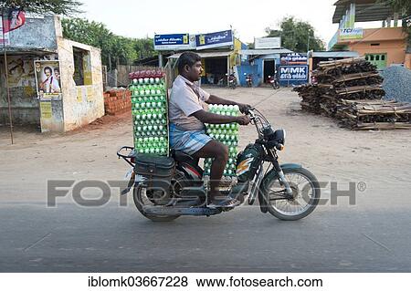 "Man riding a scooter laden with eggs, Rameswaram, Pamban Island, Tamil Nadu, India, Asia" View Large Photo Image Stock Photo - "Man riding a scooter laden with eggs, Rameswaram, Pamban Island, Tamil Nadu, India, Asia". Fotosearch