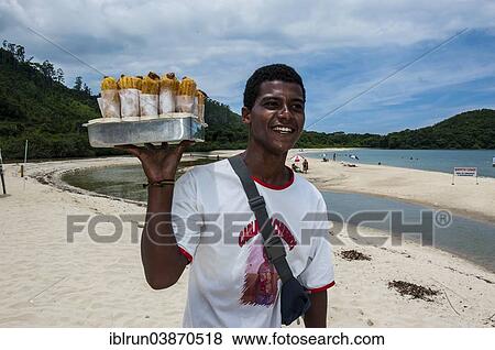 "Man selling fruit juice on a beach north of Paraty, Rio de Janeiro State, Brazil, South America" View Large Photo Image Stock Photo - "Man selling fruit juice on a beach north of Paraty, Rio de Janeiro State, Brazil, South America". Fotosearch