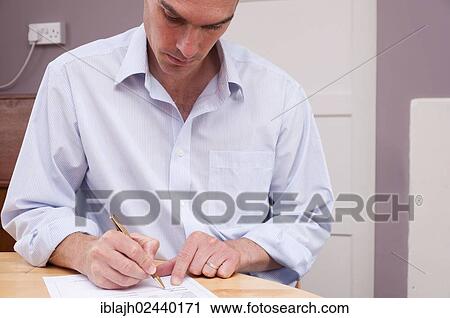 "Man signing contract, paperwork, documents" View Large Photo Image Stock Image - "Man signing contract, paperwork, documents". Fotosearch