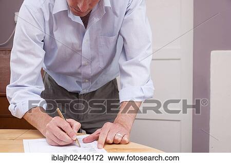"Man signing contract, paperwork, documents" View Large Photo Image Stock Image - "Man signing contract, paperwork, documents". Fotosearch