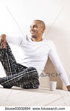 "Man sitting comfortably at home, with a cup of tea, Mannheim, Baden-Wurttemberg, Germany, Europe" View Large Photo Image Picture - "Man sitting comfortably at home, with a cup of tea, Mannheim, Baden-Wurttemberg, Germany, Europe". Fotosearch
