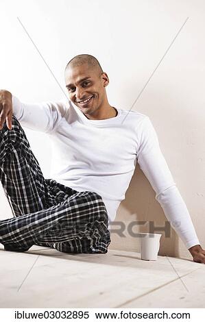 "Man sitting comfortably at home, with a cup of tea, Mannheim, Baden-Wurttemberg, Germany, Europe" View Large Photo Image Stock Photography - "Man sitting comfortably at home, with a cup of tea, Mannheim, Baden-Wurttemberg, Germany, Europe". Fotosearch
