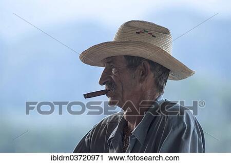 "Man smoking a cigar, Vinales, Pinar del Rio Province, Cuba, North America" View Large Photo Image Stock Image - "Man smoking a cigar, Vinales, Pinar del Rio Province, Cuba, North America". Fotosearch