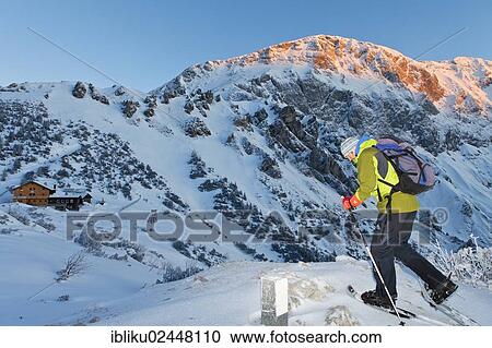 "Man snowshoeing towards Carl-von-Stahl-House on Torrener Joch pass, sun shining on Hohes Brett mountain, a mountain hut from the Alpine Club on the border of Berchtesgaden-Salzburg, Berchtesgadener Land, Bavaria, Germany, Europe" View Large Photo Image Stock Image - "Man snowshoeing towards Carl-von-Stahl-House on Torrener Joch pass, sun shining on Hohes Brett mountain, a mountain hut from the Alpine Club on the border of Berchtesgaden-Salzburg, Berchtesgadener Land, Bavaria, Germany, Europe". Fotosearch