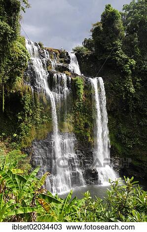 "Man standing above a large waterfall, Tad Yuang, Bolaven Plateau, Laos, Southeast Asia, Asia" View Large Photo Image Stock Image - "Man standing above a large waterfall, Tad Yuang, Bolaven Plateau, Laos, Southeast Asia, Asia". Fotosearch