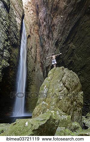 "Man standing at the waterfall of Cachoeira da Fumacinha, Lencois, Bahia, Brazil, South America" View Large Photo Image Stock Photo - "Man standing at the waterfall of Cachoeira da Fumacinha, Lencois, Bahia, Brazil, South America". Fotosearch