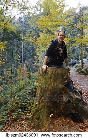 "Man standing in a hollow tree trunk, Black Forest, Germany, Europe" View Large Photo Image Stock Image - "Man standing in a hollow tree trunk, Black Forest, Germany, Europe". Fotosearch