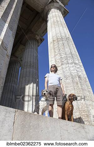 "Man standing with two dogs at the Walhalla, Donaustauf, Bavaria, Germany, Europe" View Large Photo Image Stock Photography - "Man standing with two dogs at the Walhalla, Donaustauf, Bavaria, Germany, Europe". Fotosearch