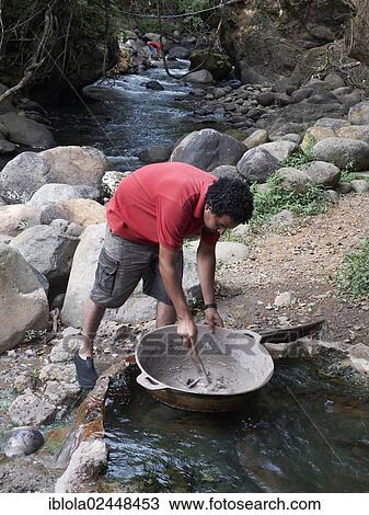"Man stirring volcanic mineral mud, Ricon de la Vieja National Park, Guanacaste province, Costa Rica, Central America, North America" View Large Photo Image Stock Image - "Man stirring volcanic mineral mud, Ricon de la Vieja National Park, Guanacaste province, Costa Rica, Central America, North America". Fotosearch