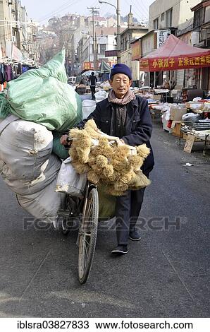 "Man transporting goods with a bicycle, Qingdao, Shandong province, China, Asia" View Large Photo Image Stock Image - "Man transporting goods with a bicycle, Qingdao, Shandong province, China, Asia". Fotosearch