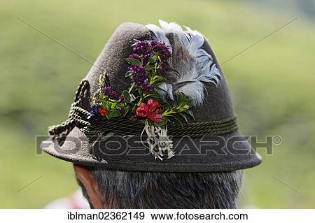 Stock Photo - "Man wearing a hat decorated with flowers, Pfeifertag festival on Niedergadenalm alp, Strobl, Salzburg state, Salzkammergut resort area, Austria, Europe". Fotosearch