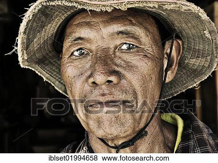 "Man wearing a hat, portrait, Laos, Southeast Asia, Asia" View Large Photo Image Stock Photo - "Man wearing a hat, portrait, Laos, Southeast Asia, Asia". Fotosearch