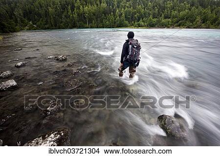 "Man wearing fishing boots on the bank of Lowe River near Valdez, Alaska, USA" View Large Photo Image Picture - "Man wearing fishing boots on the bank of Lowe River near Valdez, Alaska, USA". Fotosearch
