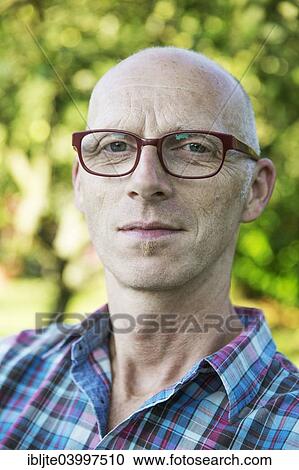 "Man wearing glasses, 50 years, portrait, Germany, Europe" View Large Photo Image Stock Image - "Man wearing glasses, 50 years, portrait, Germany, Europe". Fotosearch