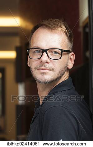 Man wearing glasses, portrait View Large Photo Image Stock Image - Man wearing glasses, portrait. Fotosearch