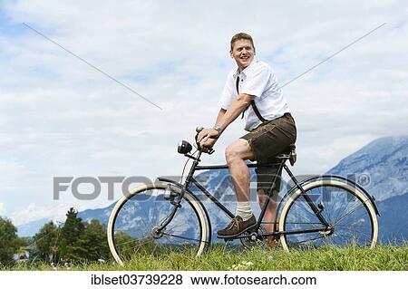 "Man wearing leather pants on an old bicycle, Igls, Innsbruck, Tyrol, Austria, Europe" View Large Photo Image Stock Photo - "Man wearing leather pants on an old bicycle, Igls, Innsbruck, Tyrol, Austria, Europe". Fotosearch