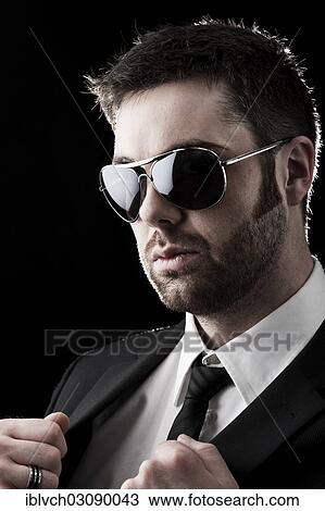 "Man wearing sunglasses with stubble, portrait, Innsbruck, Tyrol, Austria, Europe" View Large Photo Image Stock Image - "Man wearing sunglasses with stubble, portrait, Innsbruck, Tyrol, Austria, Europe". Fotosearch