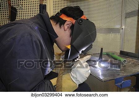 "Man welding at a vocational school, Ystad, Scania, Sweden, Europe" View Large Photo Image Picture - "Man welding at a vocational school, Ystad, Scania, Sweden, Europe". Fotosearch