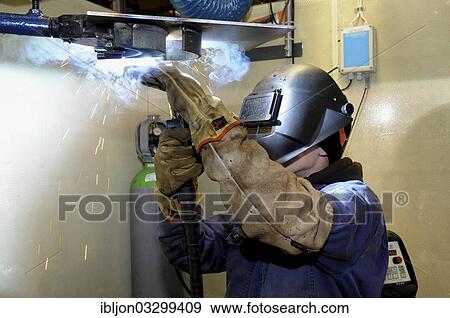 "Man welding at a vocational school, Ystad, Scania, Sweden, Europe" View Large Photo Image Stock Photo - "Man welding at a vocational school, Ystad, Scania, Sweden, Europe". Fotosearch
