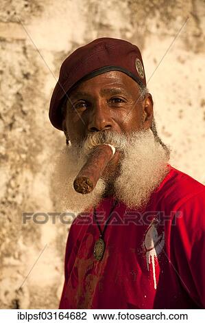 "Man with a beard smoking a cigar, Havana, Cuba, North America" View Large Photo Image Stock Image - "Man with a beard smoking a cigar, Havana, Cuba, North America". Fotosearch