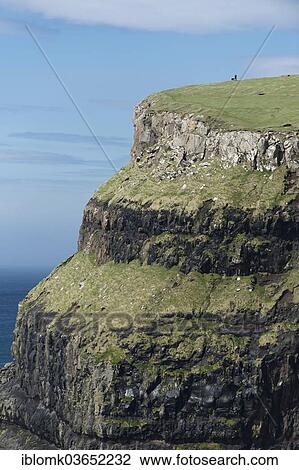 "Man with a dog at the top of a cliff, Gasadalur, Vagar, Faroe Islands, Denmark, Europe" View Large Photo Image Stock Image - "Man with a dog at the top of a cliff, Gasadalur, Vagar, Faroe Islands, Denmark, Europe". Fotosearch
