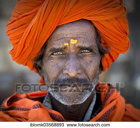 "Man with and orange turban and yellow bindi on his forehead, portrait, Chittorgarh Fort, Chittorgarh, Rajasthan, India, Asia" View Large Photo Image Stock Image - "Man with and orange turban and yellow bindi on his forehead, portrait, Chittorgarh Fort, Chittorgarh, Rajasthan, India, Asia". Fotosearch