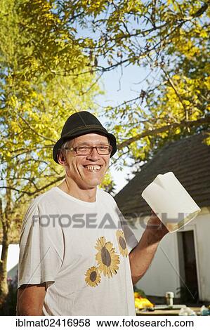 Man with freshly squeezed apple juice View Large Photo Image Stock Photo - Man with freshly squeezed apple juice. Fotosearch