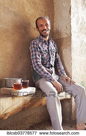 Stock Photo - "Man with Iranian tea, old town, Yazd, Yazd Province, Persia, Iran, Asia". Fotosearch