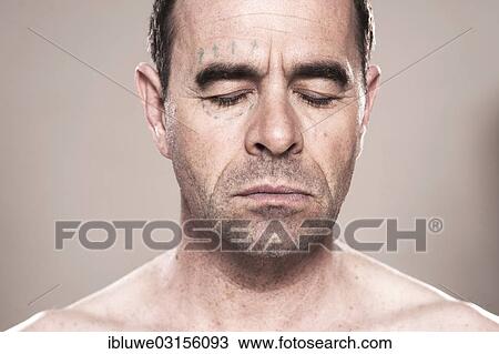 Stock Image - "Man with markings for plastic surgery on his face, Mannheim, Baden-Wurttemberg, Germany, Europe". Fotosearch