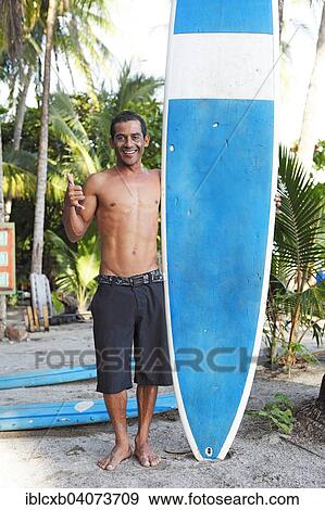 "Man with surfboard, Playa Samara, Nicoya Peninsula, Guanacaste Province, Costa Rica, North America" View Large Photo Image Stock Photo - "Man with surfboard, Playa Samara, Nicoya Peninsula, Guanacaste Province, Costa Rica, North America". Fotosearch
