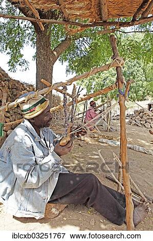 Stock Photo - "Man working on a loom, Rhumsiki, Far North, Cameroon, Africa". Fotosearch