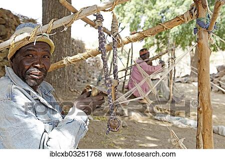 "Man working on a loom, Rhumsiki, Far North, Cameroon, Africa" View Large Photo Image Stock Photo - "Man working on a loom, Rhumsiki, Far North, Cameroon, Africa". Fotosearch