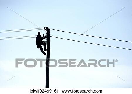 Man working on a power pole View Large Photo Image Stock Image - Man working on a power pole. Fotosearch