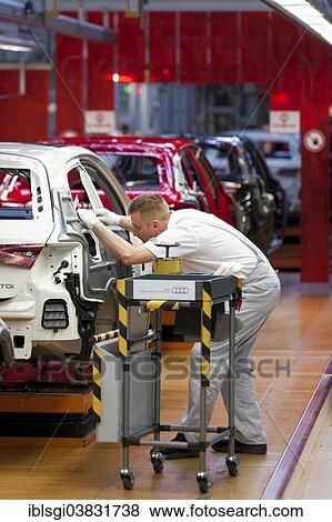 "Man working on the production line of the Audi A3 at the Audi plant, Ingolstadt, Bavaria, Germany, Europe" View Large Photo Image Stock Photo - "Man working on the production line of the Audi A3 at the Audi plant, Ingolstadt, Bavaria, Germany, Europe". Fotosearch