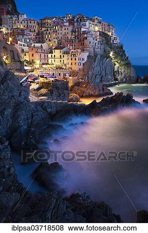Stock Photo - "Manarola village in the evening with sea surf, Manarola, Cinque Terre, Liguria, Italy, Europe". Fotosearch