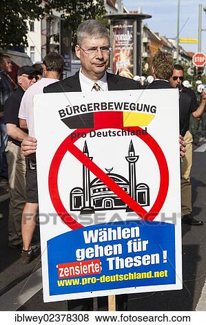 "Manfred Rouhs, chairman of """"Pro-Deutschland"""", Pro-Germany, rally, protests, vigil of the right-wing populist """"Pro-Germany"""" party in Flughafenstrasse street, Berlin, Europe" View Large Photo Image Stock Photo - "Manfred Rouhs, chairman of """"Pro-Deutschland"""", Pro-Germany, rally, protests, vigil of the right-wing populist """"Pro-Germany"""" party in Flughafenstrasse street, Berlin, Europe". Fotosearch