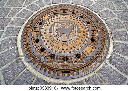"Manhole cover with the bull, coat of arms of the town of Guestrow, Gustrow, Mecklenburg-Western Pomerania, Germany, Europe" View Large Photo Image Stock Photo - "Manhole cover with the bull, coat of arms of the town of Guestrow, Gustrow, Mecklenburg-Western Pomerania, Germany, Europe". Fotosearch