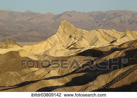 "Manly Beacon in the morning light, a rocky outcrop in the badlands below Zabriskie Point, the Panamint Range in the back, Death Valley National Park, California, USA" View Large Photo Image Stock Image - "Manly Beacon in the morning light, a rocky outcrop in the badlands below Zabriskie Point, the Panamint Range in the back, Death Valley National Park, California, USA". Fotosearch