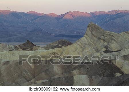 "Manly Beacon, on the right, a rocky outcrop in the badlands below Zabriskie Point, at dawn, Death Valley National Park, California, USA" View Large Photo Image Stock Image - "Manly Beacon, on the right, a rocky outcrop in the badlands below Zabriskie Point, at dawn, Death Valley National Park, California, USA". Fotosearch