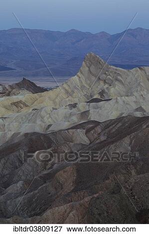 "Manly Beacon, on the right, a rocky outcrop in the badlands below Zabriskie Point, at dawn, Death Valley National Park, California, USA" View Large Photo Image Stock Photo - "Manly Beacon, on the right, a rocky outcrop in the badlands below Zabriskie Point, at dawn, Death Valley National Park, California, USA". Fotosearch