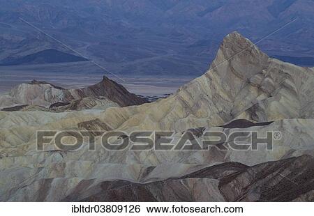 "Manly Beacon, on the right, a rocky outcrop in the badlands below Zabriskie Point, at dawn, Death Valley National Park, California, USA" View Large Photo Image Stock Photograph - "Manly Beacon, on the right, a rocky outcrop in the badlands below Zabriskie Point, at dawn, Death Valley National Park, California, USA". Fotosearch