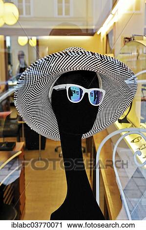 Mannequin wearing a hat and sunglasses View Large Photo Image Stock Image - Mannequin wearing a hat and sunglasses. Fotosearch