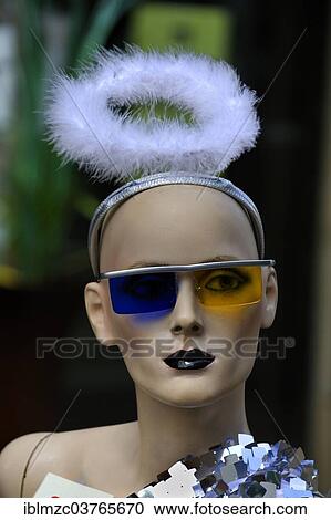 "Mannequin with a feathers halo and sunglasses with different color glasses, Erlangen, Middle Franconia, Bavaria, Germany, Europe" View Large Photo Image Stock Image - "Mannequin with a feathers halo and sunglasses with different color glasses, Erlangen, Middle Franconia, Bavaria, Germany, Europe". Fotosearch