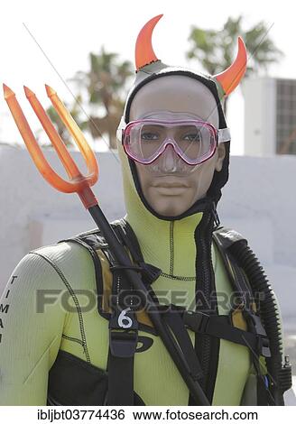 "Mannequin with diving equipment, devil horns and trident as an advertisement for a diving center, Puerto del Carmen, Lanzarote, Canary Islands, Spain, Europe" View Large Photo Image Stock Photograph - "Mannequin with diving equipment, devil horns and trident as an advertisement for a diving center, Puerto del Carmen, Lanzarote, Canary Islands, Spain, Europe". Fotosearch